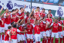 Arsenal players celebrate with the Premier League trophy after winning the 2025/26 title