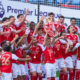 Arsenal players celebrate with the Premier League trophy after winning the 2025/26 title