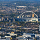 Aerial view of Wembley Stadium and its arch, surrounded by north-west London